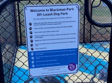 Off-leash dog park sign