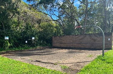 Basketball hoop and tennis wall