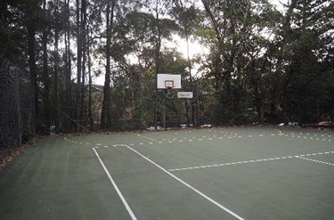 tennis court and basketball hoop