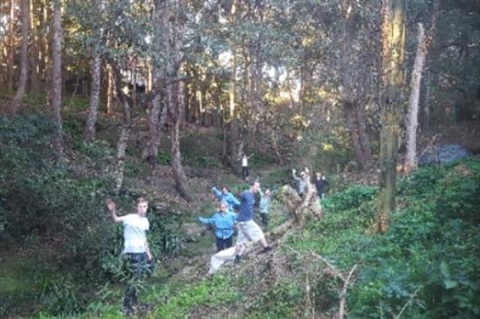 Volunteers waving from the gully
