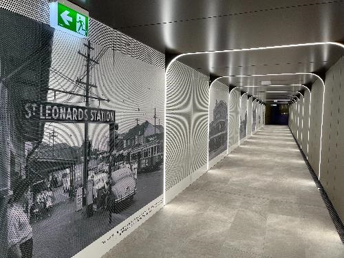 The underpass at St Leonards. The tunnel is well-lit and images from the past are displayed on the left hand side of the tunnel.