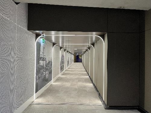 The underpass at St Leonards. The tunnel is well-lit and images from the past are displayed on the left hand side of the tunnel. 