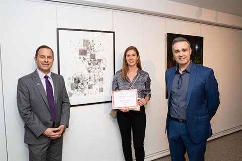 Mayor Andrew Zbik, Michelle de Jong and Miguel Olmo standing in front of Michelle's winning artwork 'Land Patterns' at Gallery Lane Cove.