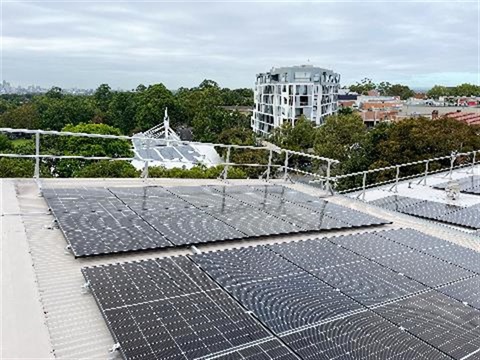 Solar panels on the Civic Centre roof. The Aquatic Centre is in the background.